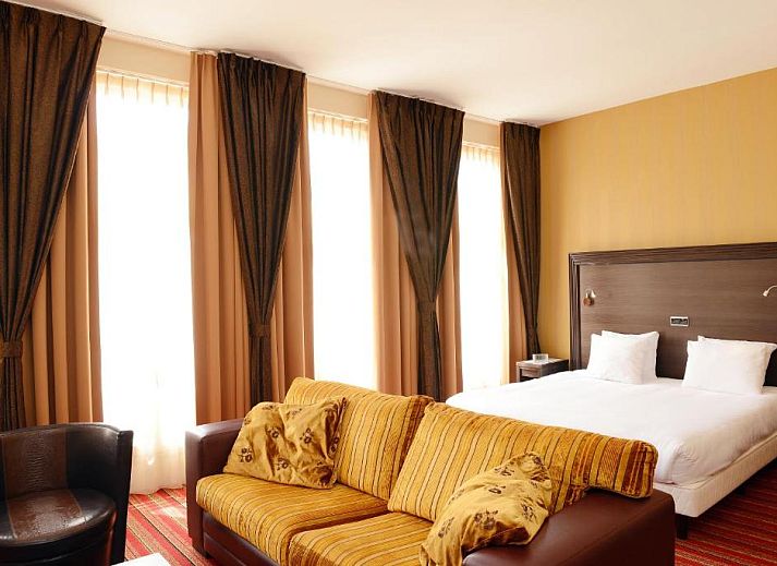 Comfortable room with a view in Amrath Grand Hotel de l'Empereur, Maastricht, perfect for a relaxing vacation.