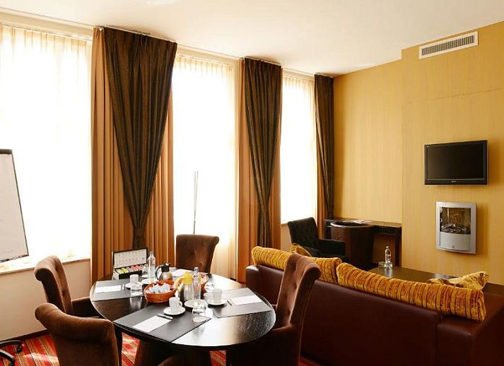 Comfortable room with a view in Amrath Grand Hotel de l'Empereur, Maastricht, perfect for a relaxing vacation.