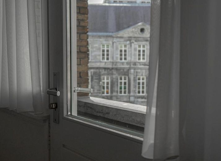 Soft towels made on bed at Hotel de la Bourse, comfortable stay in South Limburg, Maastricht.