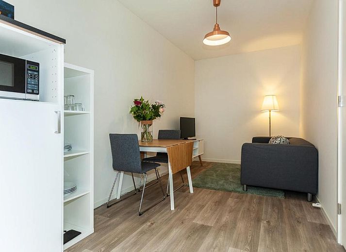 Bright living room in Museumpark Apartments, Rotterdam, with views of the surroundings.