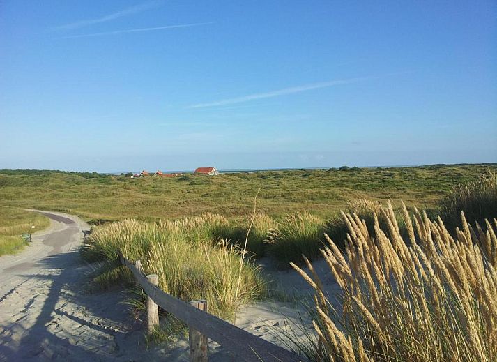 Gezellige binnenruimte met houten details in Hotel Posthuys Vlieland, Oost, vakantieappartement.