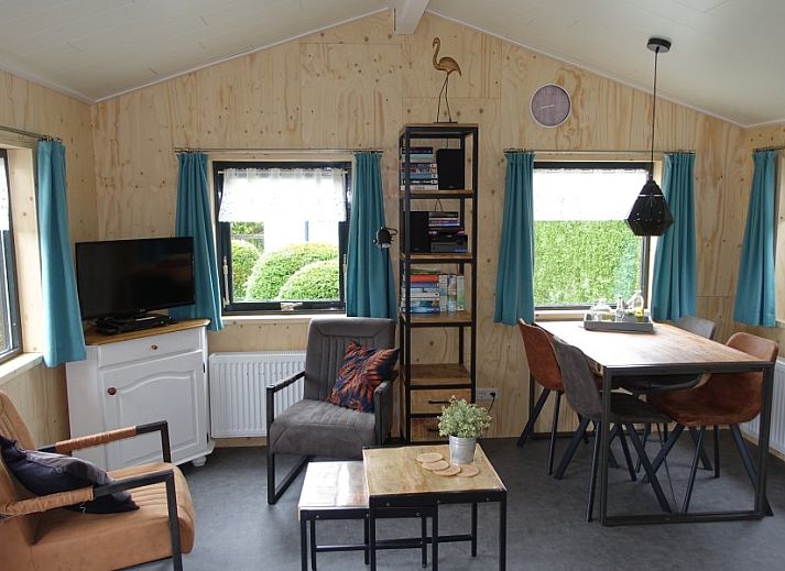 Noorderlicht vacation home in Formerum, Terschelling with wooden facade and cozy terrace.