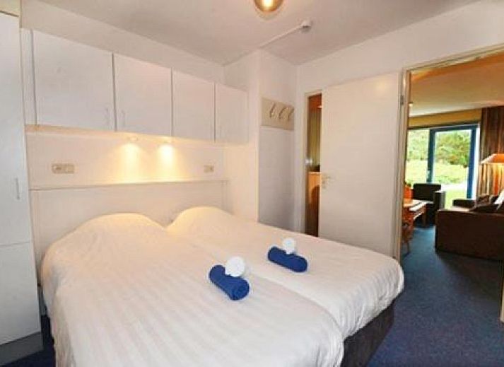 Apartment Amelander-Kaap TIME-OUT with SWIMMING POOL in Hollum, Ameland overlooking the pond and green surroundings.