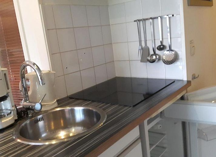 Modern kitchen in Apartment Amelander-Kaap TIME-OUT with SWIMMING POOL, Hollum, Ameland, with induction cooktop and convenient amenities.