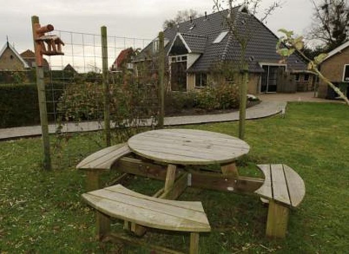 Enjoy peace and quiet at the Farmhouse in Hoorn, Terschelling, with a beautiful terrace and green surroundings.