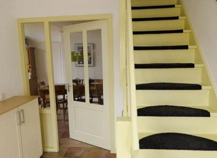 Enjoy peace and quiet at the Farmhouse in Hoorn, Terschelling, with a beautiful terrace and green surroundings.