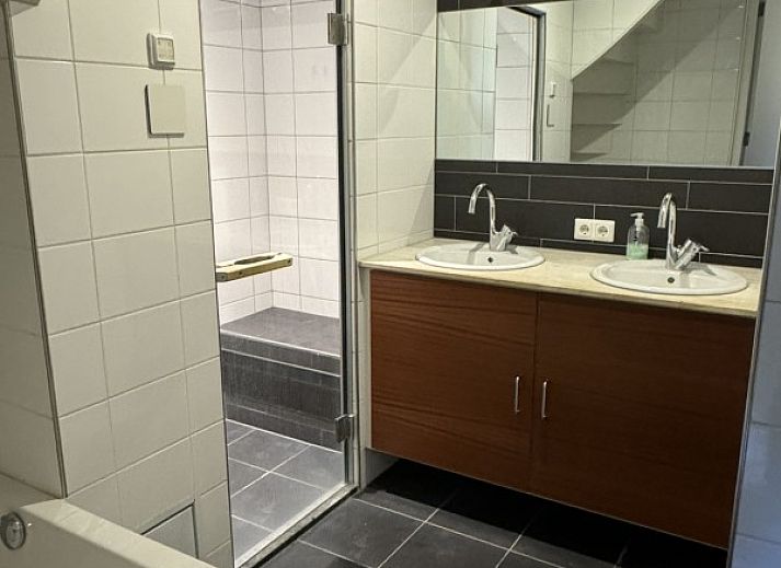 Terrace of De Hoek in Hoorn, Terschelling with comfortable seating and green surroundings.