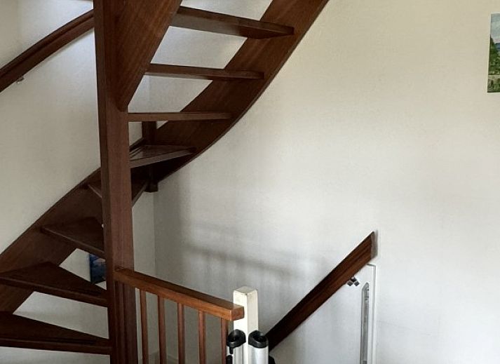 Terrace of De Hoek in Hoorn, Terschelling with comfortable seating and green surroundings.