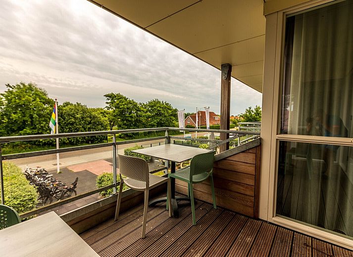 Comfortabele zithoek in DeLuxe Appartement, Midsland, Terschelling, met moderne inrichting.