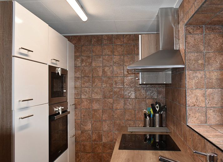 Kinderkamer in Duinvilla De Reddingboot, Oosterend, Terschelling met schattige dierenprints.