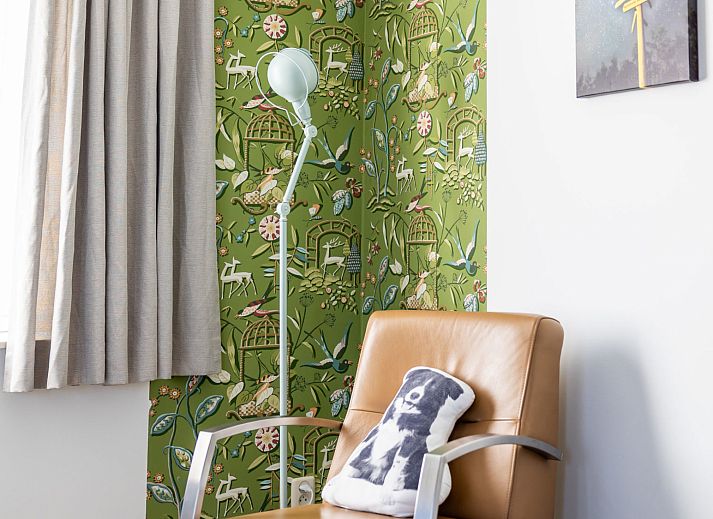 Cozy bedroom in Apartment Bath Douche, Oosterend, Terschelling with wooden headboard and atmospheric lighting.