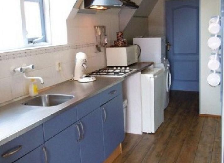 Charmant appartement Havenzicht met houten gevel in West, Terschelling, ideaal voor een ontspannen verblijf op de Waddeneilanden.