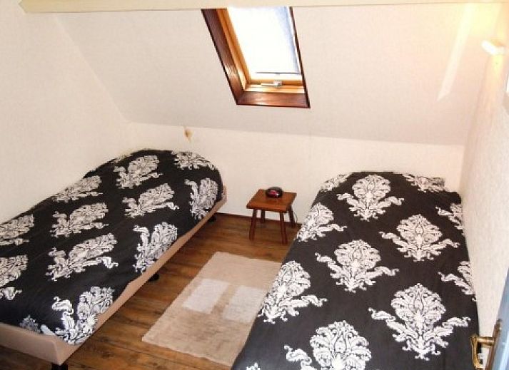 Charmant appartement Havenzicht met houten gevel in West, Terschelling, ideaal voor een ontspannen verblijf op de Waddeneilanden.