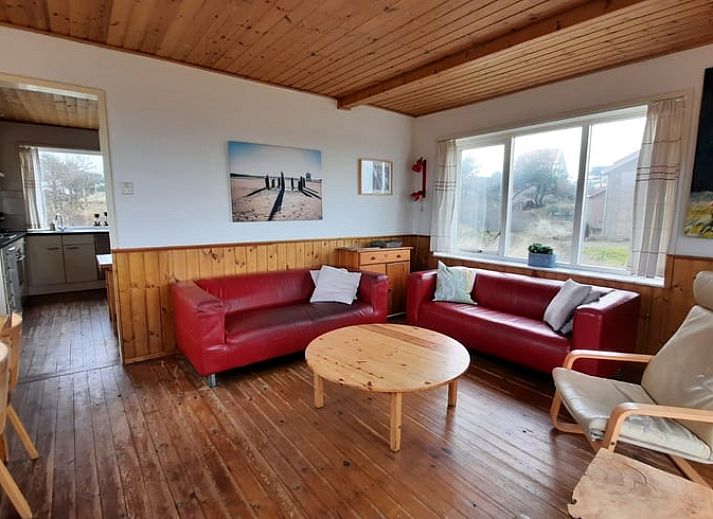 Vakantiehuisje in West aan Zee, Terschelling met uitzicht op duinen, ideaal voor ontspanning op de Waddeneilanden.