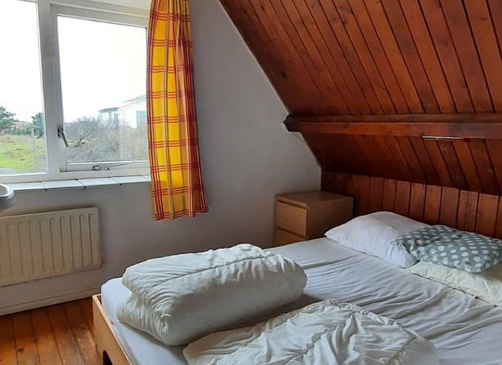 Vakantiehuisje in West aan Zee, Terschelling met uitzicht op duinen, ideaal voor ontspanning op de Waddeneilanden.