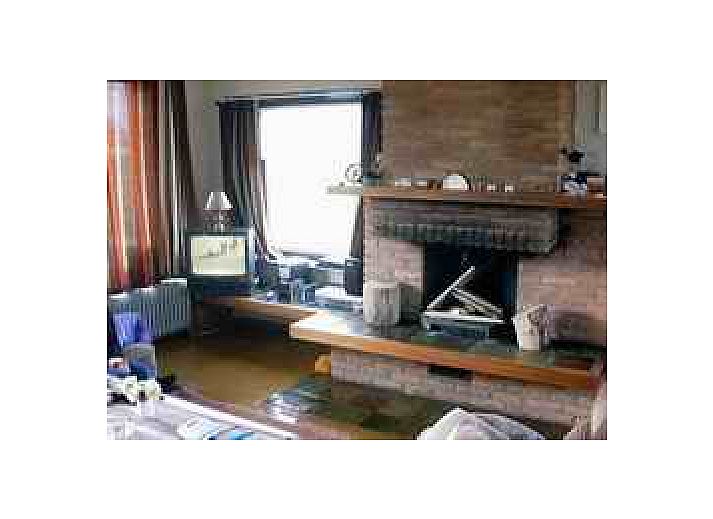 Bungalow De Wielewaal in West aan Zee, Terschelling omgeven door duinen en natuur, ideaal voor rustzoekers op de Waddeneilanden.