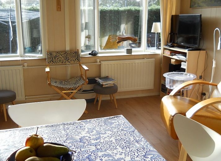 Cozy kitchen in Koekoeksdune chalet, Midsland Noord, Terschelling with dining area.