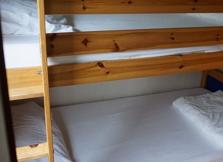 Cozy terrace at Dunamar chalet, Midsland Noord, Terschelling, with deck chairs and garden table.