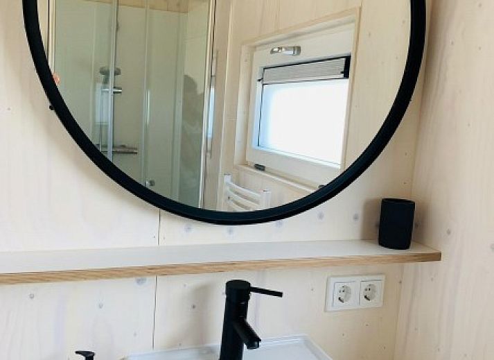 Cozy interior of Kleine Walvis vacation home in Midsland Noord, Terschelling with modern furnishings.