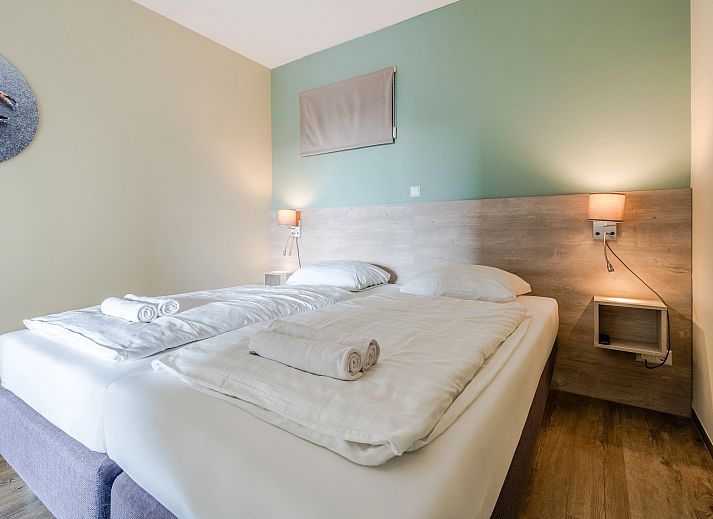 Ruime zithoek in West Terschelling 4-persoons appartement 4CA, ideaal voor ontspanning na een dag op de Waddeneilanden.