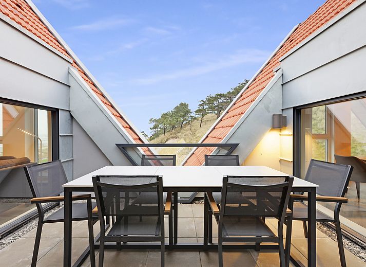 Cozy living room in 6-person penthouse 6LP in West-Terschelling, Wadden Islands with modern interior and beautiful view.