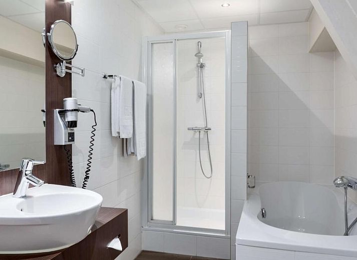 Gezellige lobby van NH Centre Utrecht Hotel met comfortabele zitplaatsen in Utrecht.