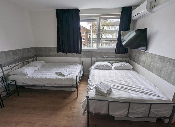 Comfortabele slaapkamer in Hotel-Chao NL, Utrecht, ideaal voor ontspanning.