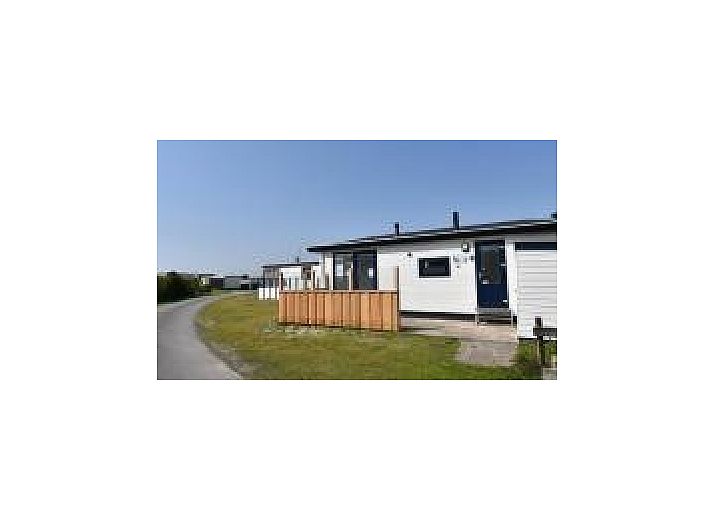 Beautiful dune landscape near Oester 167 chalet, Ballum, Ameland overlooking the lighthouse.