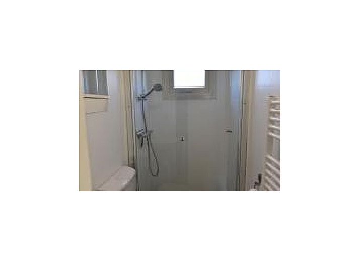 Beautiful dune landscape near Oester 167 chalet, Ballum, Ameland overlooking the lighthouse.