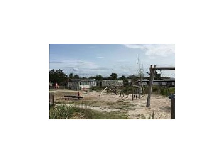 Cozy bedroom in Oester 167 vacation home, Ballum, Ameland with double bed and built-in closets.