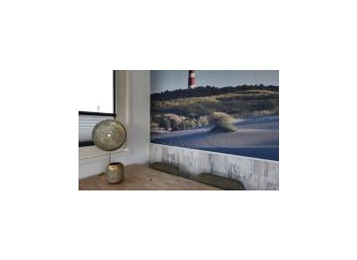 Cozy bedroom in Oester 167 vacation home, Ballum, Ameland with double bed and built-in closets.