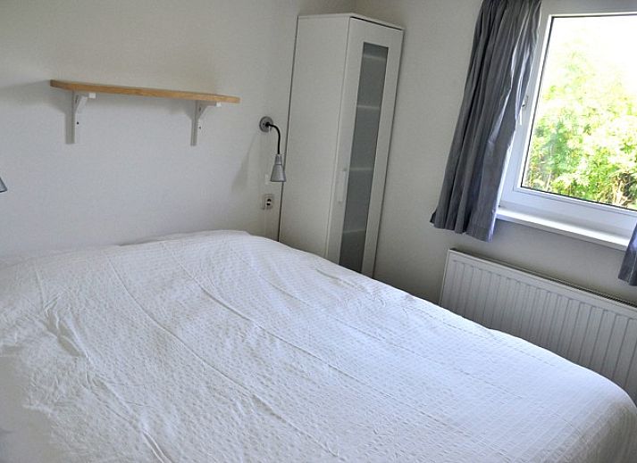 Modern kitchen in bungalow Marjan, Ballum, Ameland with dining area on the Wadden Islands.