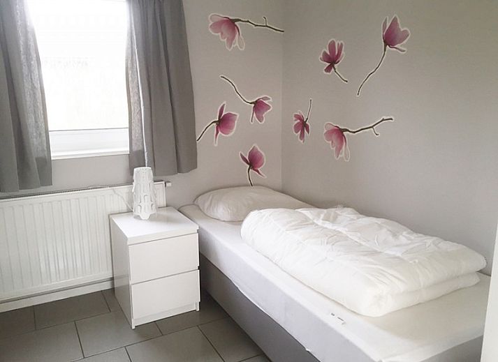 Modern kitchen in bungalow Marjan, Ballum, Ameland with dining area on the Wadden Islands.