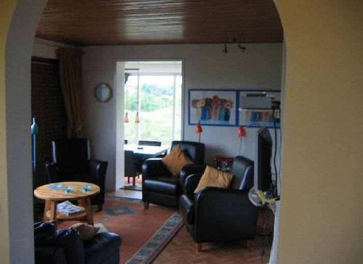 Markerwaard vacation home in Nes, Ameland overlooking green nature and blue sky, ideal for tranquility seekers on the Wadden Islands.