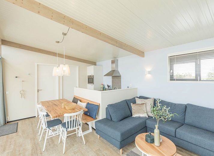 Oerd Family vacation home in Hollum, Ameland with modern veranda and wooden facades for a relaxing stay in the Wadden Islands.