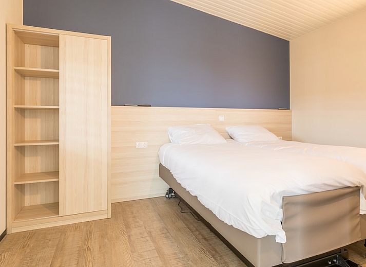 Gezellige woonkamer in Wadden Special vakantiehuis in Hollum, Ameland met moderne inrichting en comfortabele zithoek.