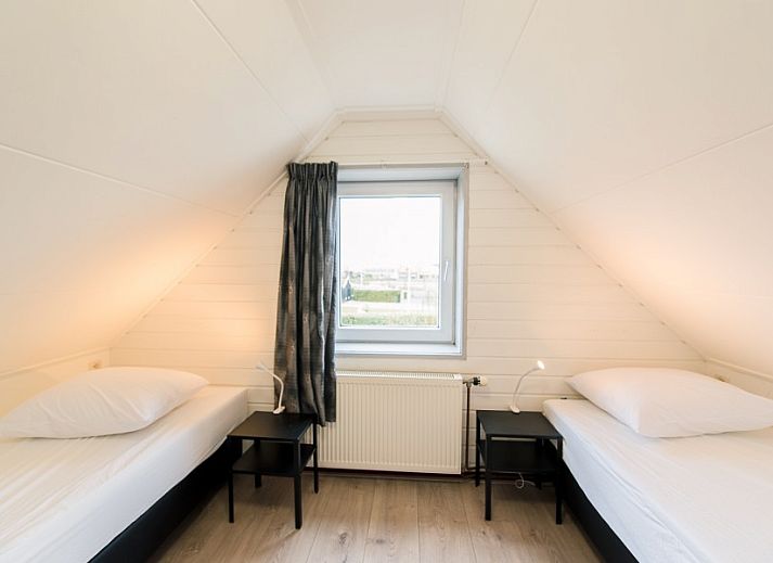 Buitenkant van vakantiehuis Onder de Pannen! omgeven door natuur in Hollum, Ameland.