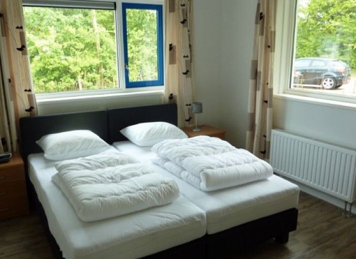 VIJVERWONING 4 vakantiehuis in Hollum, Ameland met ruim terras en groene tuin, ideaal voor ontspanning op de Waddeneilanden.