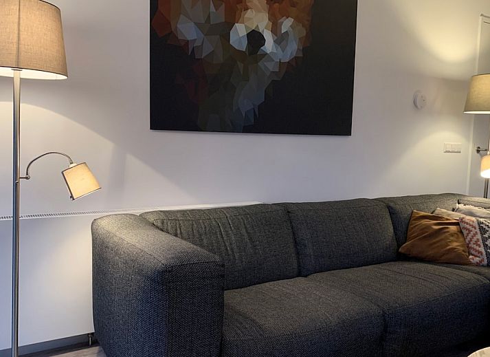 Enjoy a sunny terrace at Duyngolf 12, a modern bungalow in Hollum, Ameland, located on the beautiful Wadden Islands.