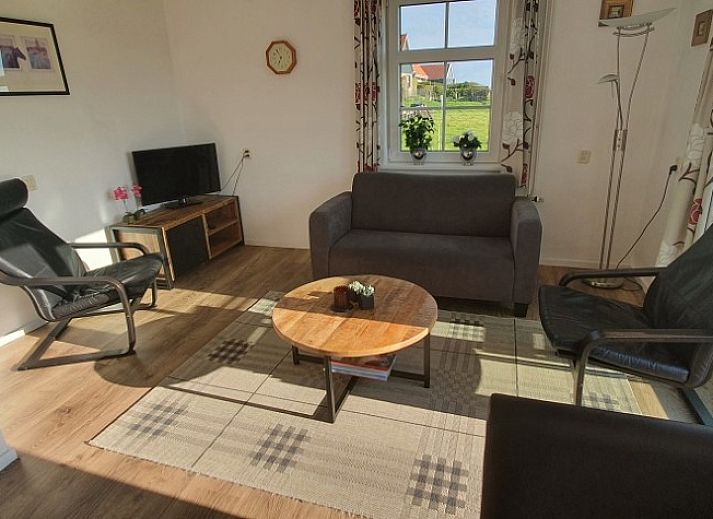 Ilsebil vacation home in Hollum, Ameland with spacious garden and view of historic church.