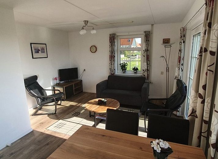 Ilsebil vacation home in Hollum, Ameland with spacious garden and view of historic church.