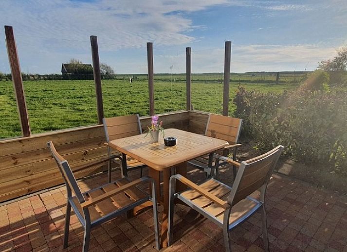 Ilsebil vacation home in Hollum, Ameland with spacious garden and view of historic church.