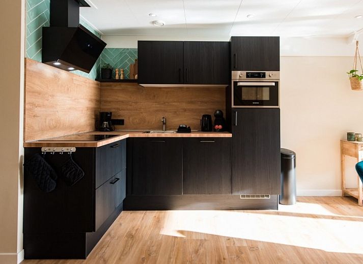 Gemuetliches Wohnzimmer von Daalders slice flat in Hollum, Ameland mit heller und moderner Einrichtung.