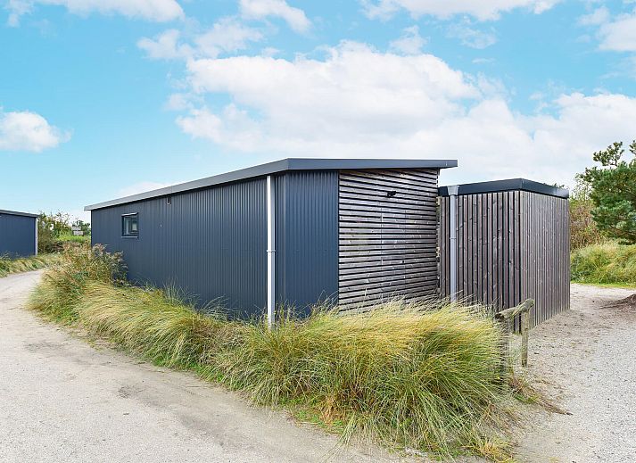Veranda van Vrijstaande woning in Hollum, Ameland met uitzicht op de natuur van de Waddeneilanden.