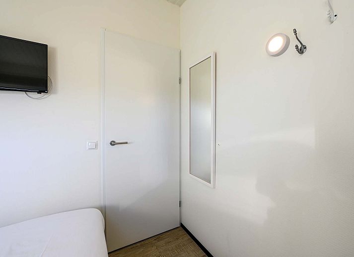 berdachte Terrasse mit Sitzgelegenheiten im Ferienhaus in Hollum, Ameland.