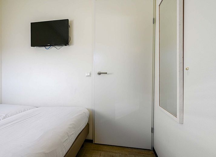 Helles Wohnzimmer eines freistehenden Hauses in Hollum, Ameland, Ferienhaus mit groen Fenstern auf den Watteninseln.