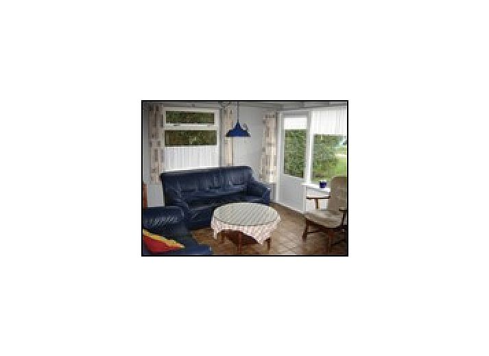 Gemtliche Essecke im Ferienhaus Pirolie, Hollum, Ameland, mit lndlicher Atmosphre und bequemen Sthlen.