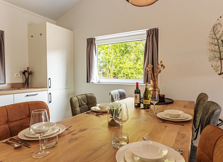 Enjoy the spacious terrace at vacation home Nesserduinen 42B in Nes, Ameland, surrounded by natural dunes and fresh air.