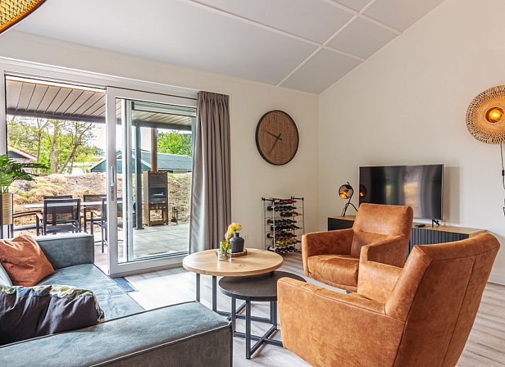 Explore the picturesque surroundings of Nesserduinen 42B, a vacation home in Nes, Ameland, with beautiful greenery and rustic paths.