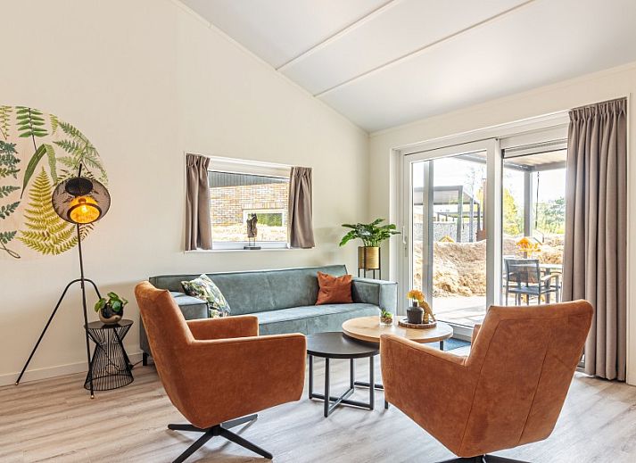 Enjoy the spacious terrace at Nesserduinen 42C in Nes, Ameland. Vacation home with comfortable outdoor space in the Wadden Islands.